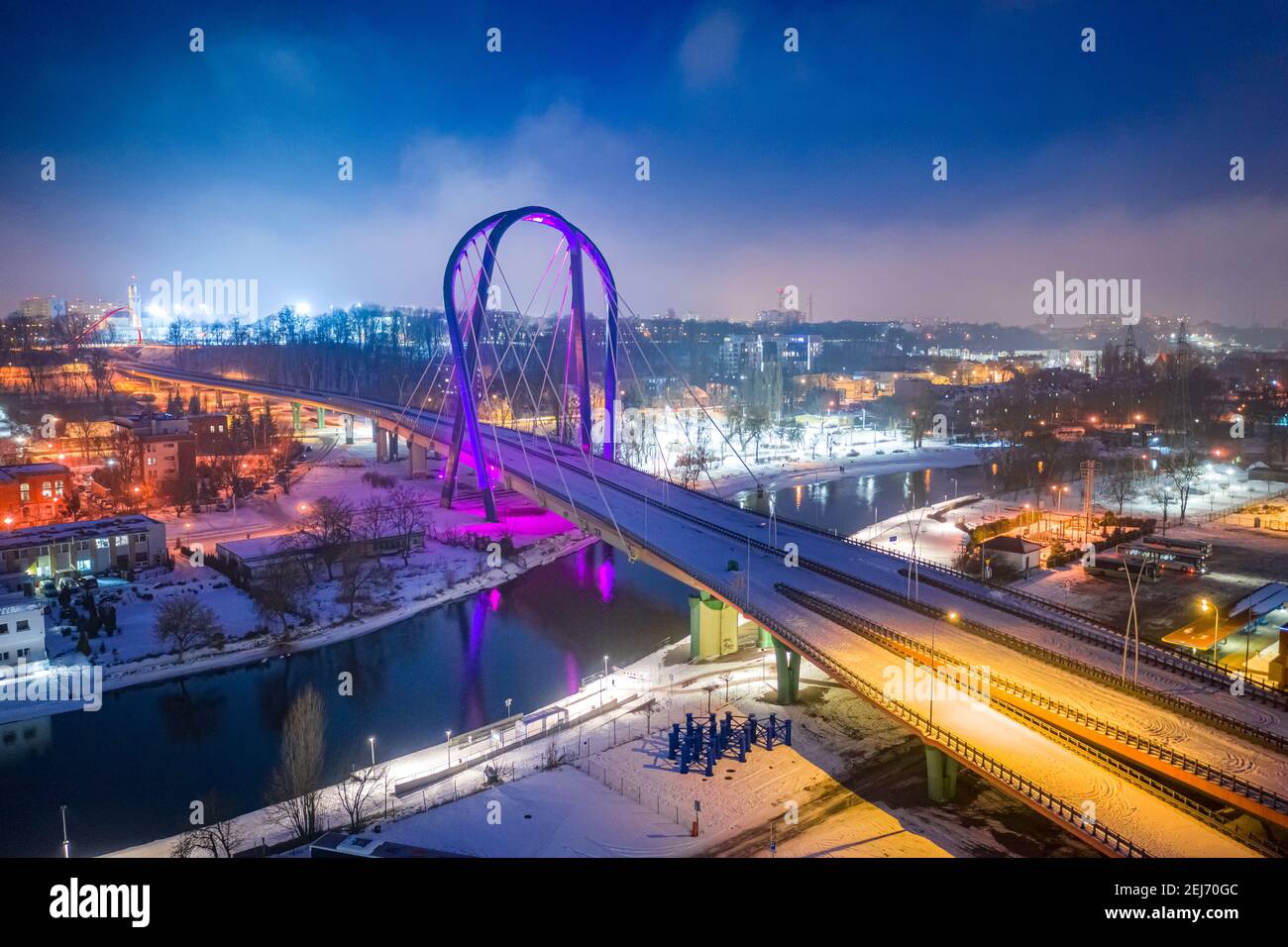 University Route in Bydgoszcz in winter by night. Bridge over Brda river. Aerial view of Poland Stock Photo