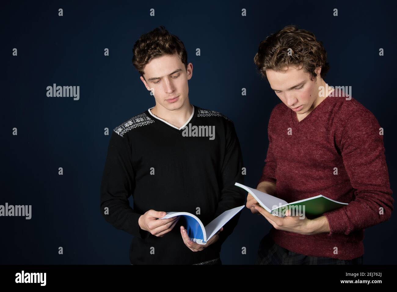 Study and work. Two young attractive students with laptops. Stock Photo