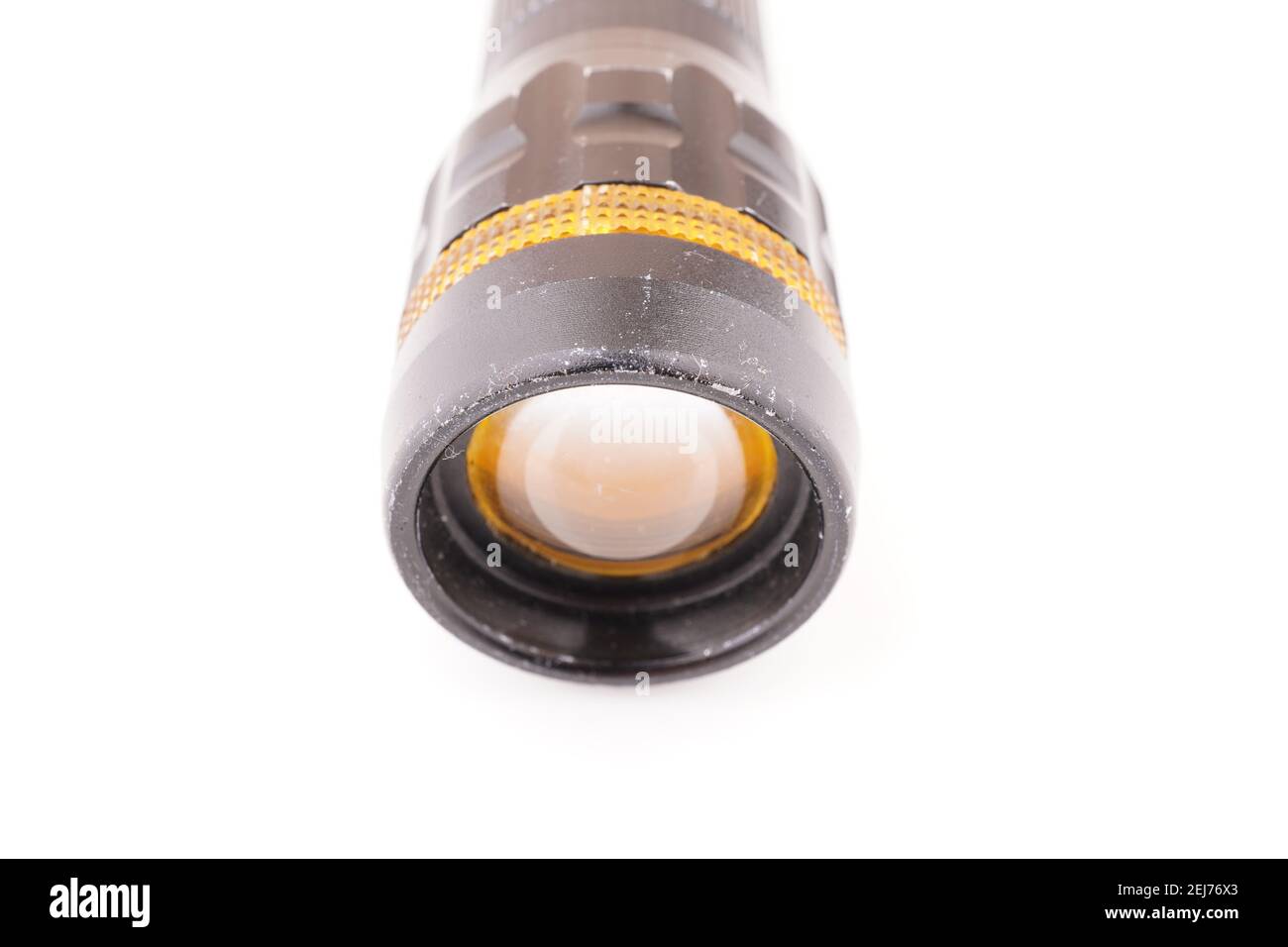 black metal flashlight on a white background Stock Photo