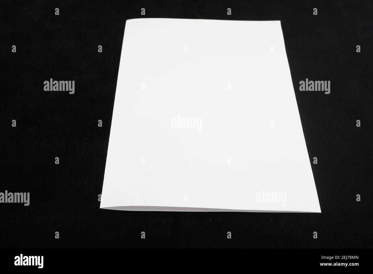 white sheet of paper on a black background Stock Photo - Alamy