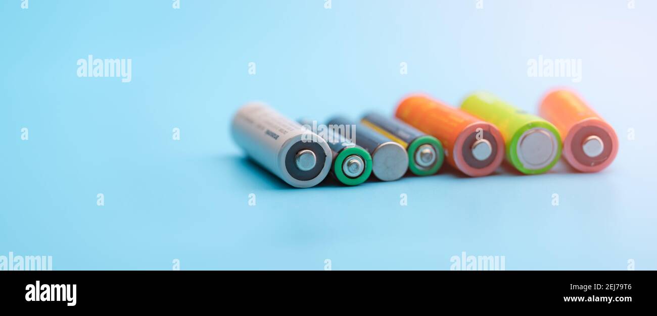 Rechargeable battery on blue background. Selective focus negative terminals  of rechargeable lithium-ion batteries. AA and AAA size of old Li-ion Stock  Photo - Alamy