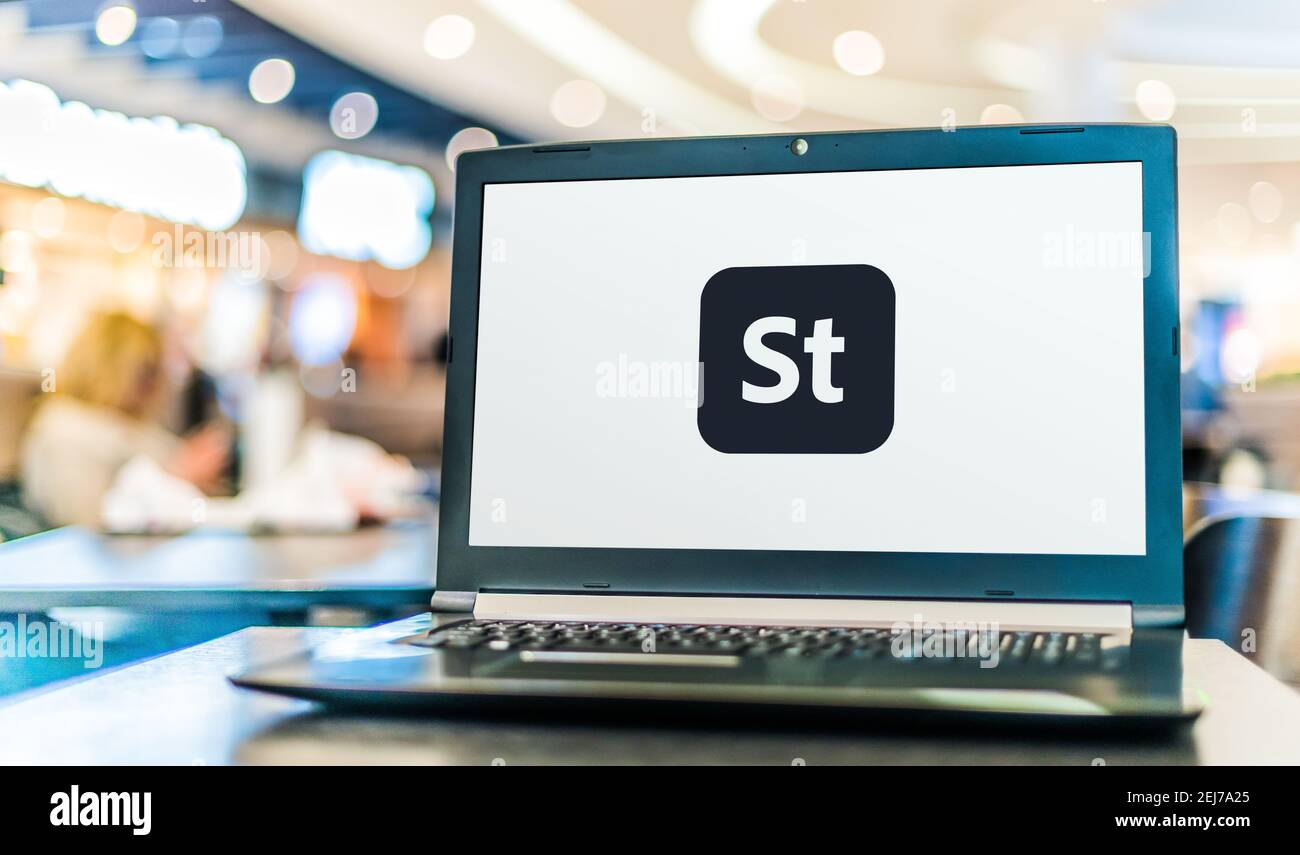 POZNAN, POL - AUG 8, 2020: Laptop computer displaying logo of Adobe Stock, a stock photography service owned by Adobe Inc Stock Photo
