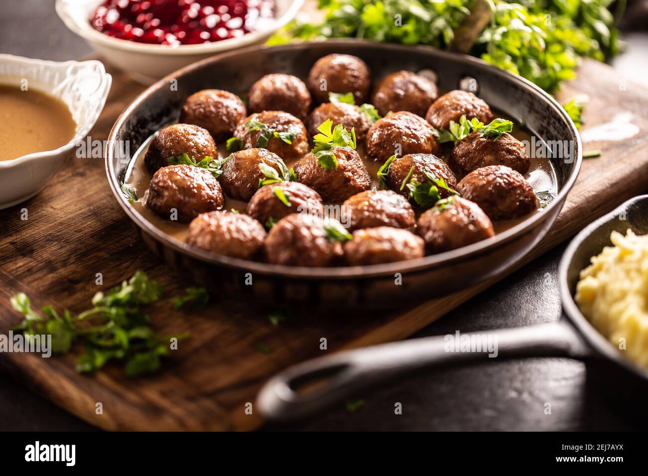 Swedish meatballs, kottbullar, in a pan topped with fresh parsley. Stock Photo