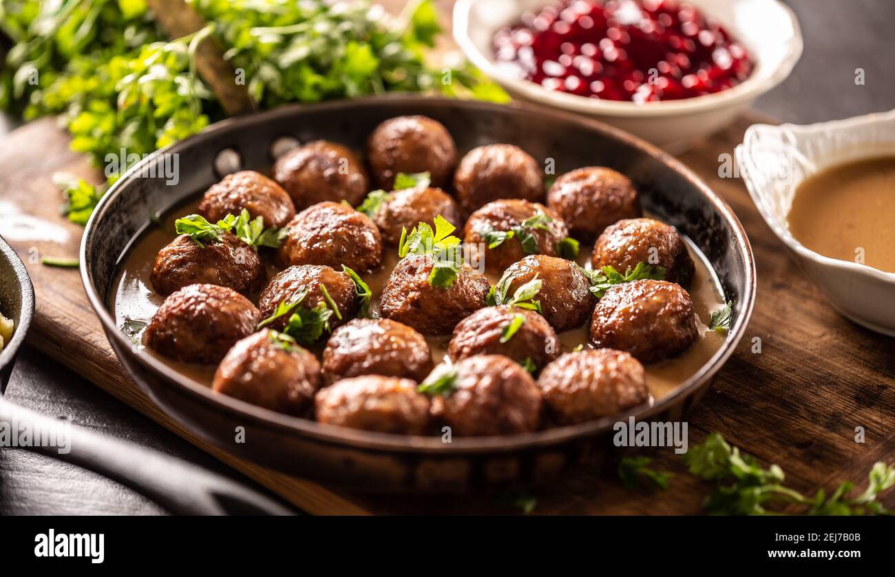 Swedish meatballs, kottbullar, in a pan topped with fresh parsley. Stock Photo