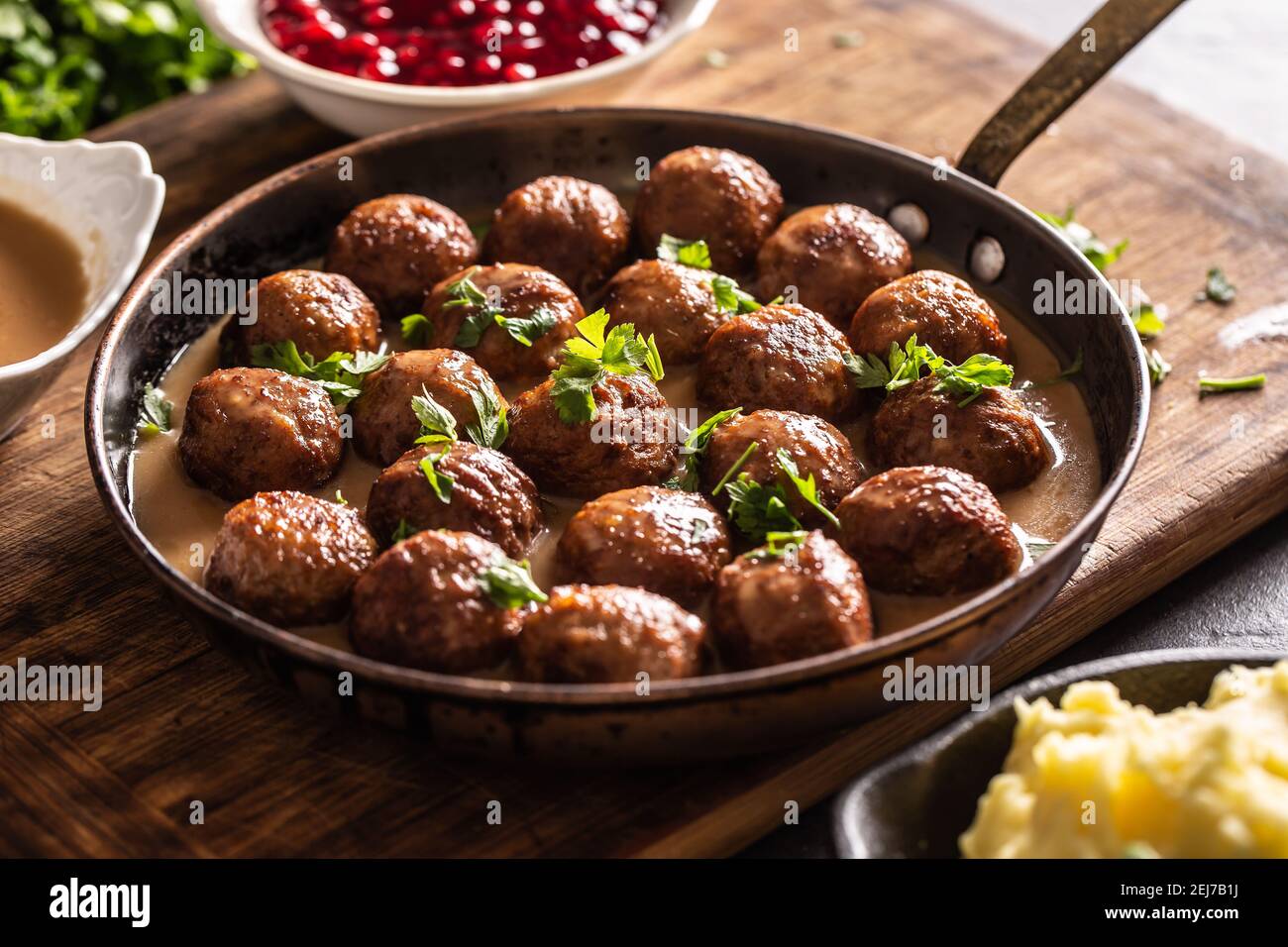 Pan with freshly-made kottbullar meatballs in a sauce. Stock Photo