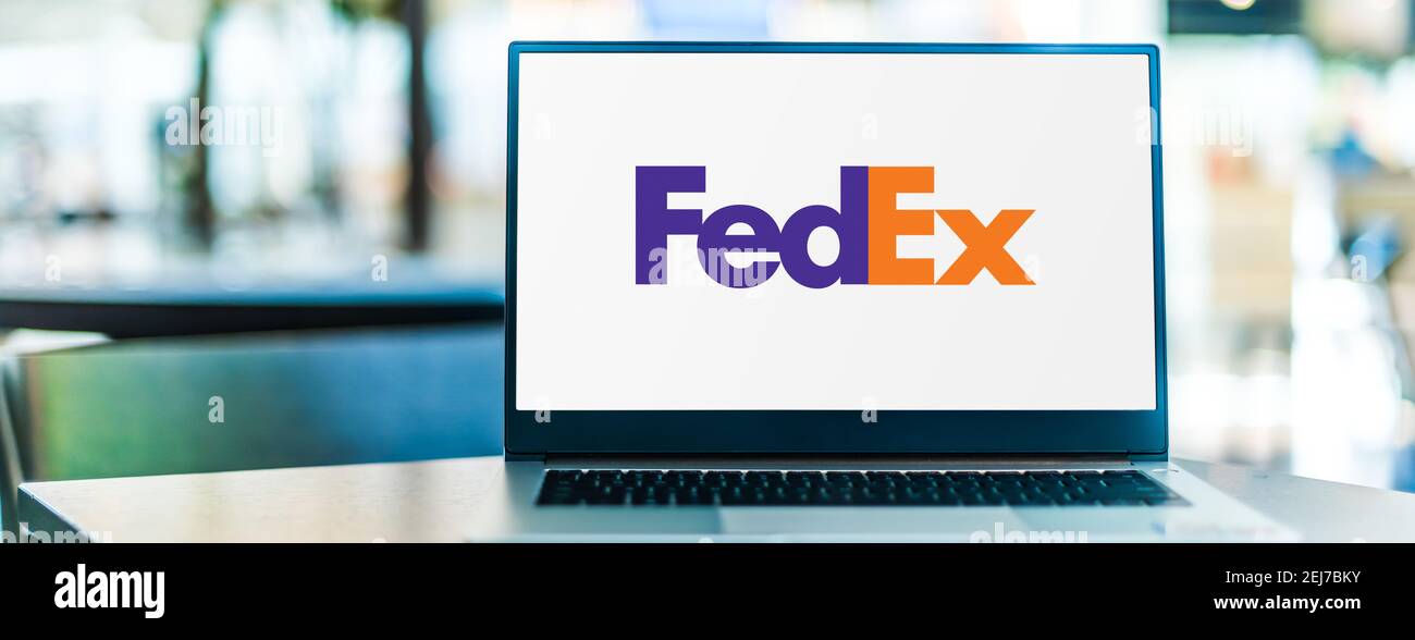 POZNAN, POL - SEP 23, 2020: Laptop computer displaying logo of FedEx Corporation, an American multinational delivery services company headquartered in Stock Photo