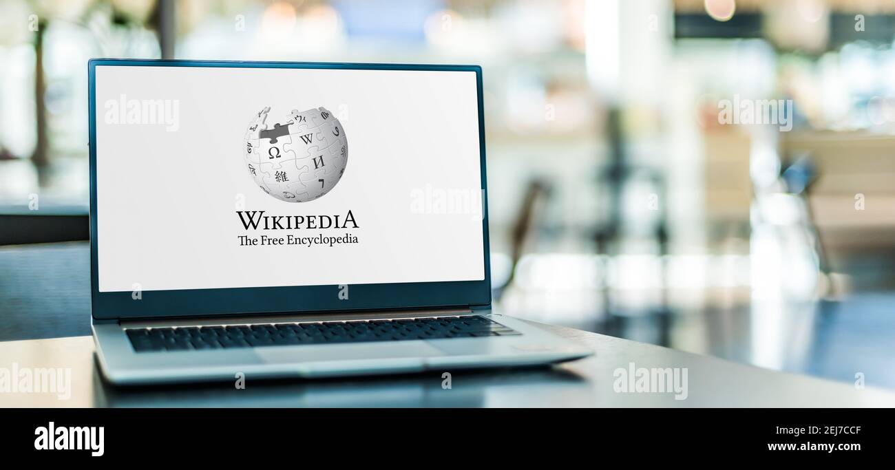 POZNAN, POL - SEP 23, 2020: Laptop computer displaying logo of Wikipedia, multilingual, web-based, free encyclopedia, owned and supported by the Wikim Stock Photo