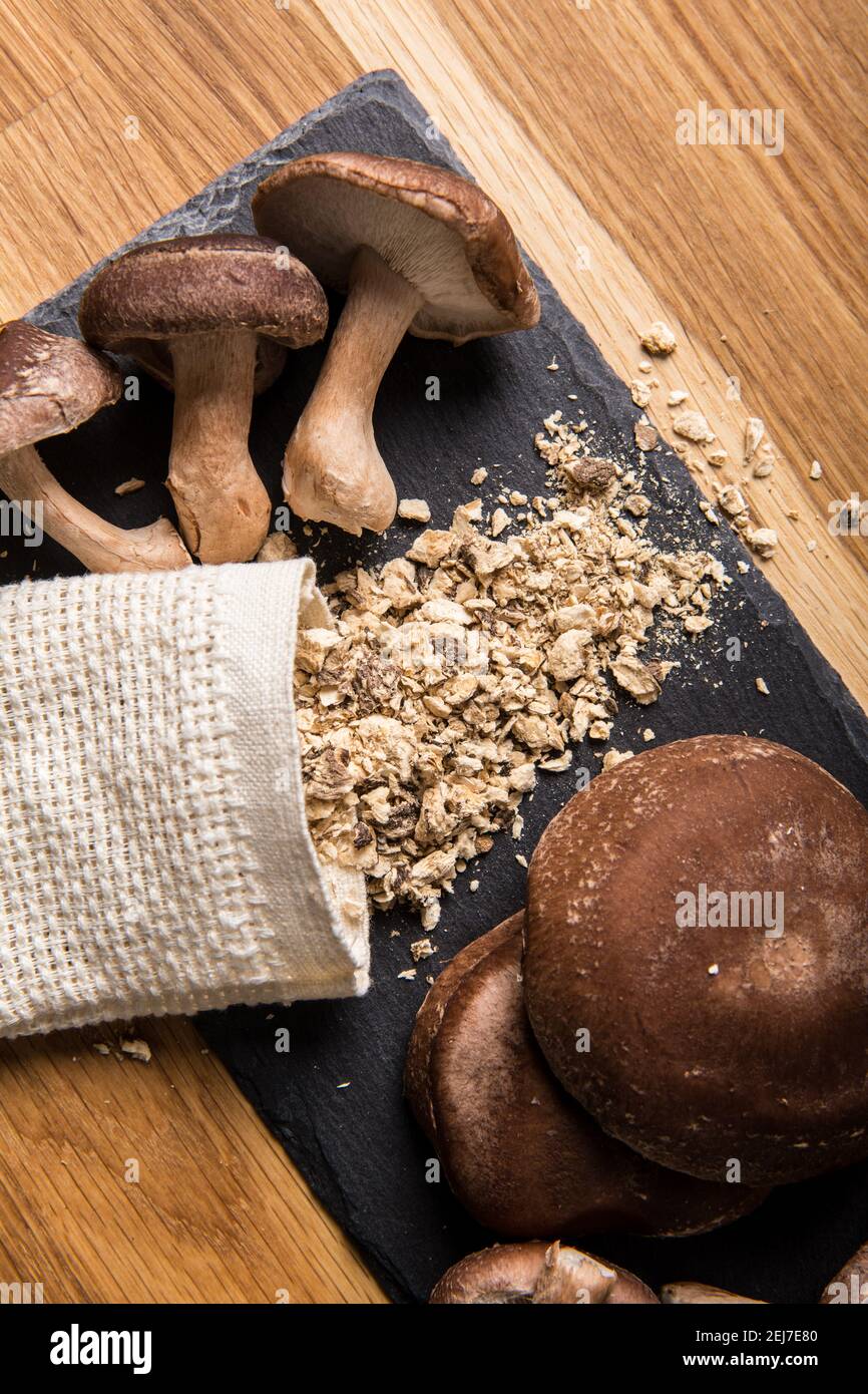 Flat lay view of dry powder made of shiitake mushrooms, Lentinula