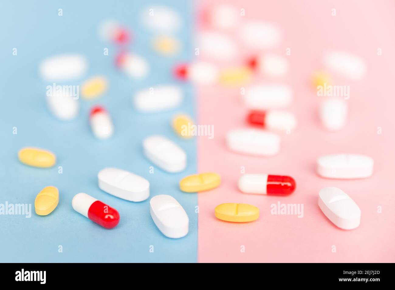 Composition with different pills with blur on colored background. Stock Photo