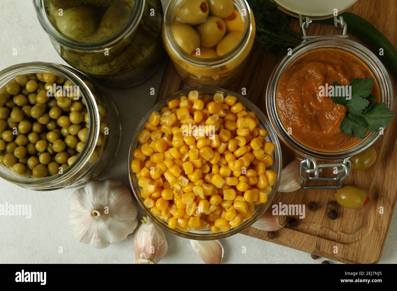 Different pickled food and ingredients on white textured background Stock Photo Alamy