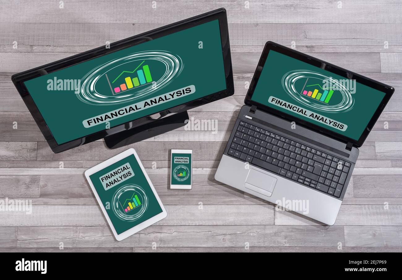 Financial analysis concept shown on different information technology ...