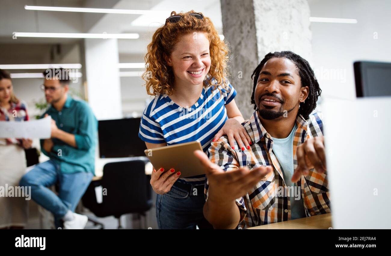 Company employees working in software development and designer office Stock Photo