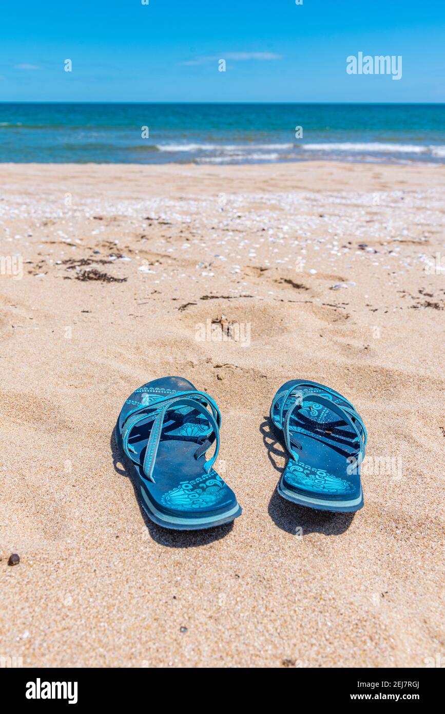 A pair of flip flops on a sandy beach in Bulgaria Stock Photo - Alamy