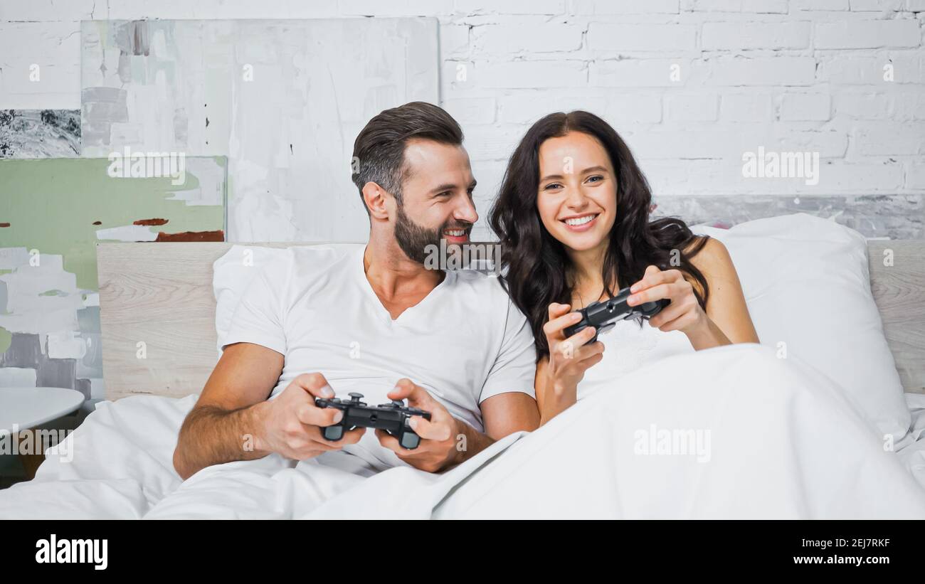 Couple playing bedroom game hi-res stock photography and images - Alamy