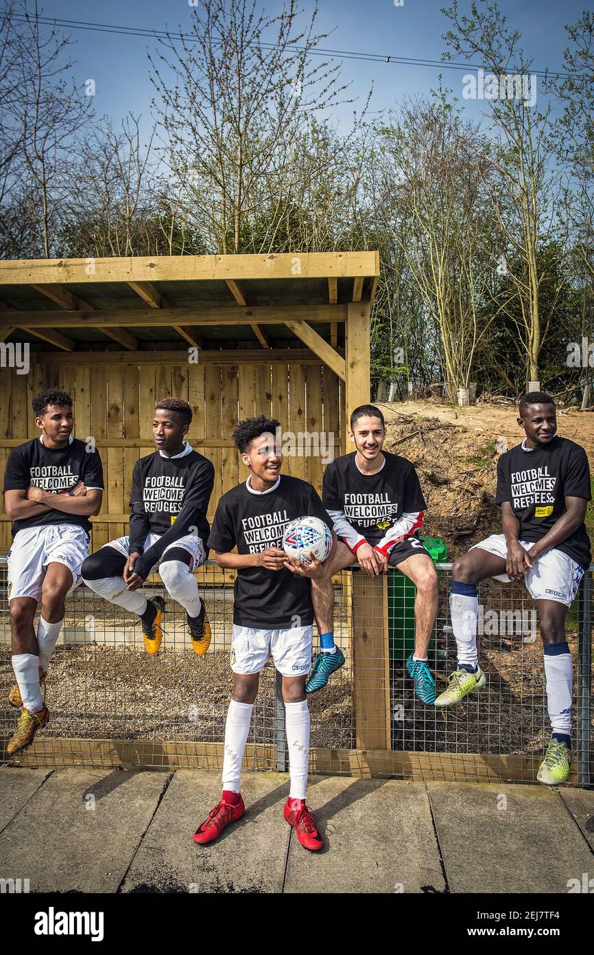 Leeds refugee players warm up for their match against the refugees from Barnsley wearing Football Welcomes T-shirts at the Training Ground, Wetherby. Stock Photo
