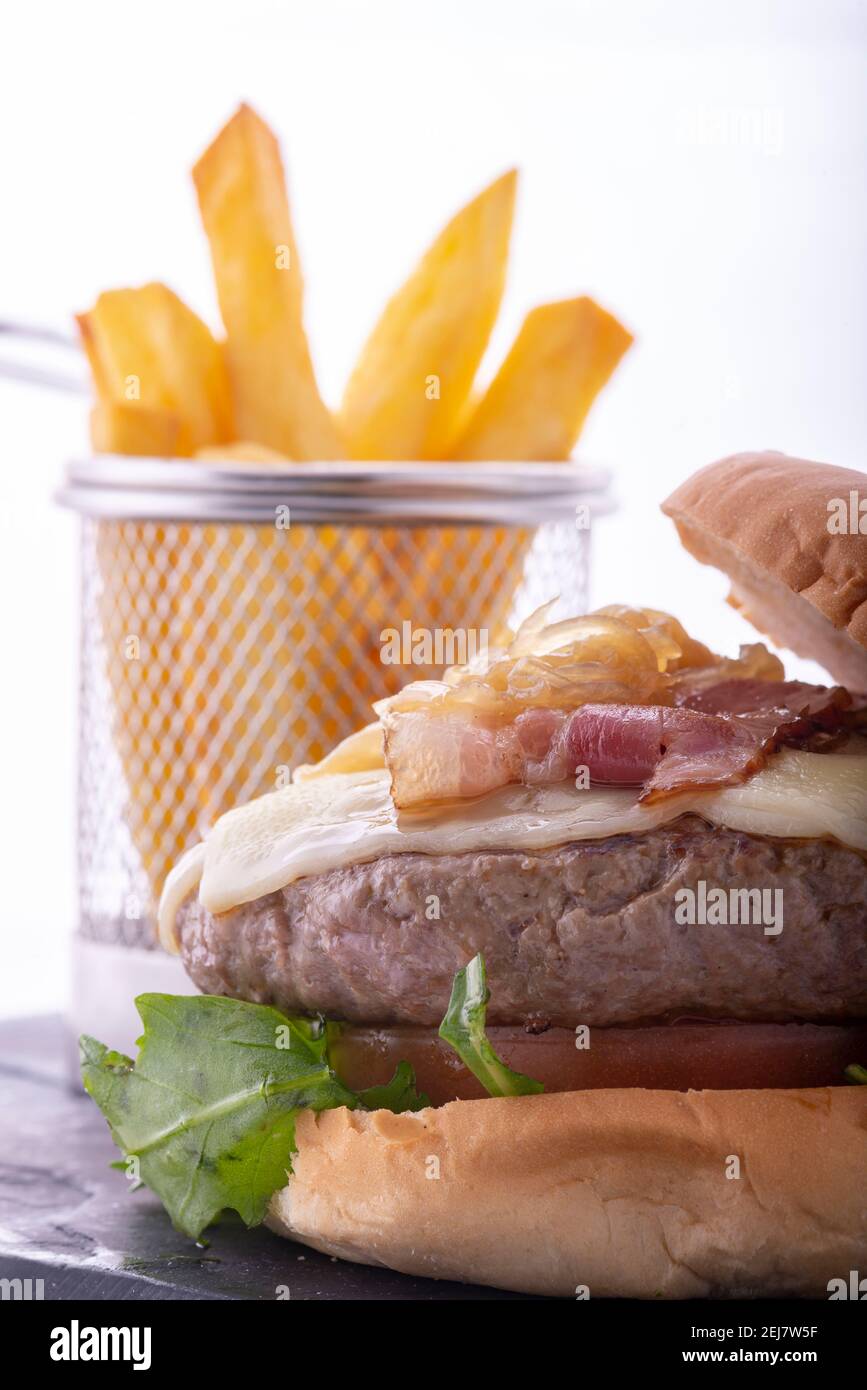 Beef burger with bacon and fries Stock Photo - Alamy
