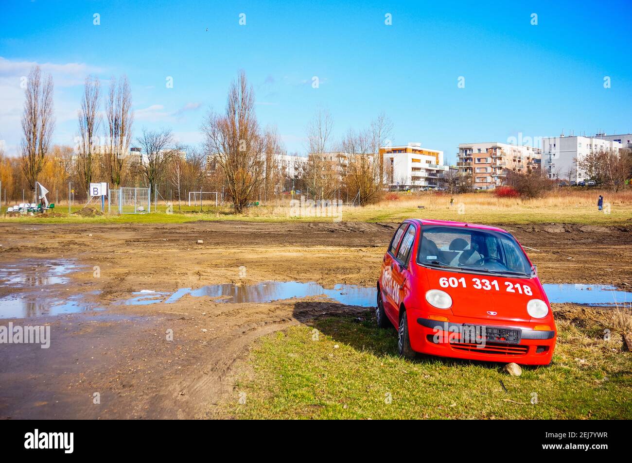 POZNAN, POLAND - Mar 09, 2019: Small red Daewoo Matiz car for sale on a wet area Stock Photo