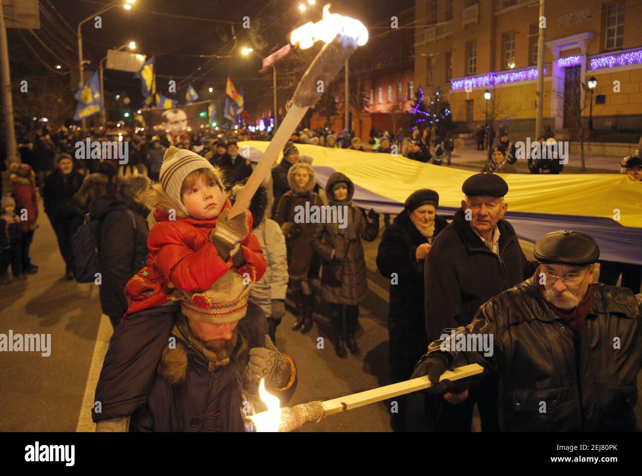 Ukrainian activists hold lit torches during a rally of different ...