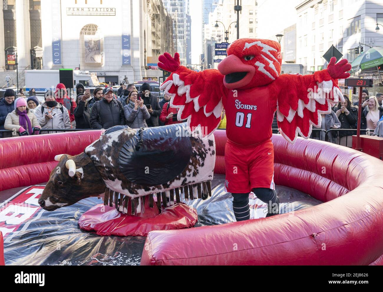 St. John’s University mascot Johnny Thunderbird rides mechanical bull