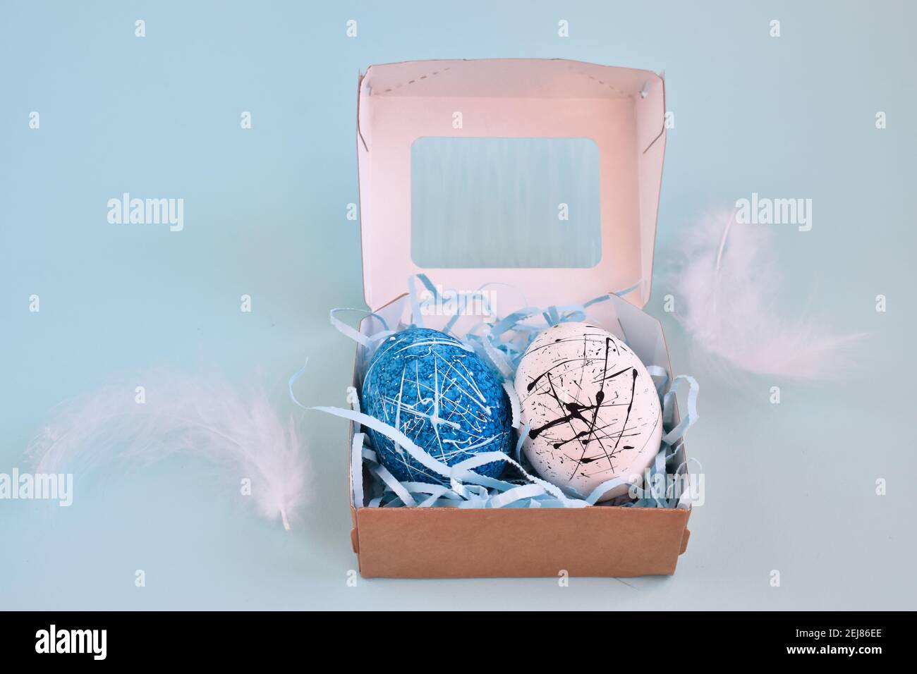 Two eggs in a paper box. Hand made. An Easter gift. Stock Photo