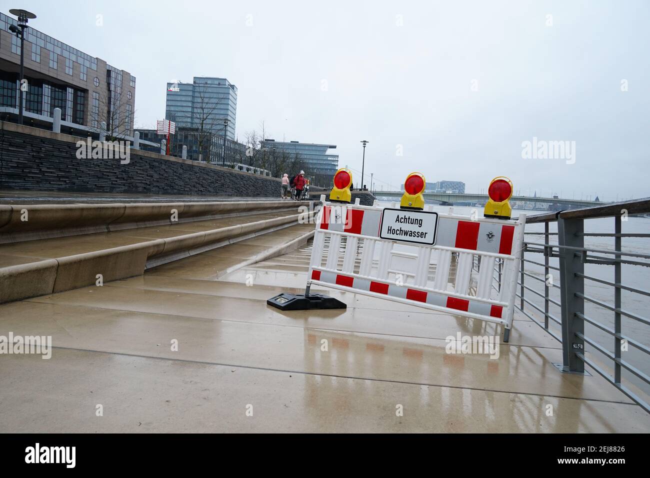 "Achtung Hochwasser - attention high tidewater" sign near the River Rhine in Cologne, Germany Stock Photo
