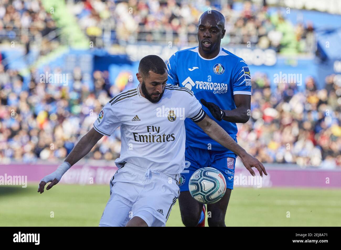 Karim Benzema of Real Madrid and Allan-Romeo Nyom of Getafe FC are seen in  action during the La Liga match between Getafe CF and Real Madrid at  Coliseum Alfonso Perez in Getafe. (