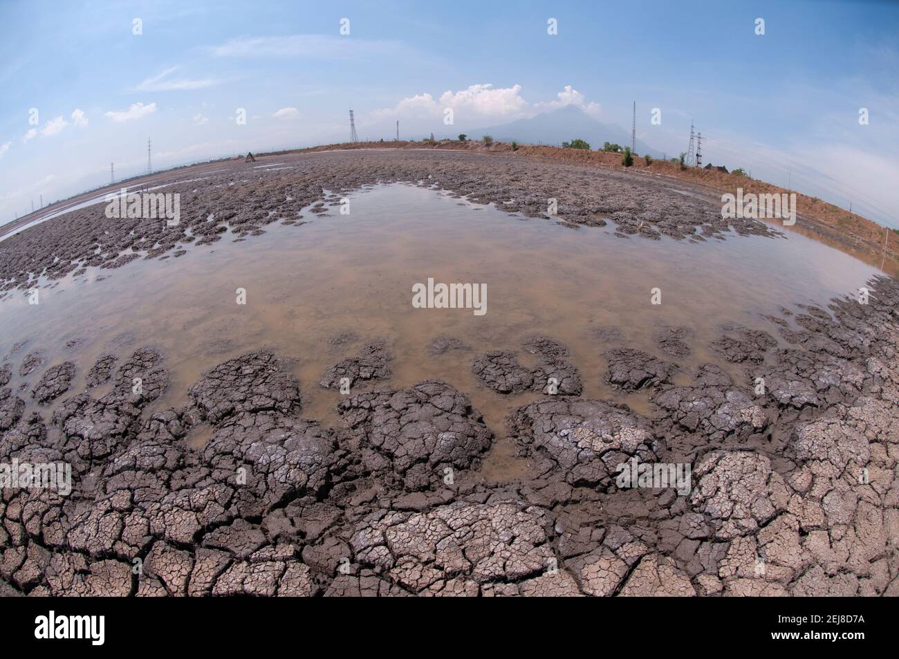 Dried mud in mud lake environmental disaster and volcano which developed after drilling incident, Porong Sidoarjo, near Surabaya, East Java, Indonesia Stock Photo