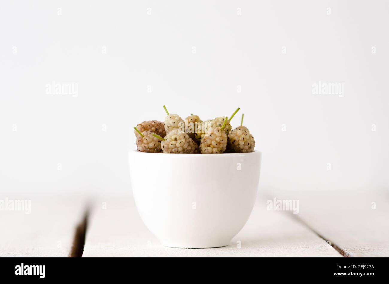 White blackberries in a white bowl. Stock Photo
