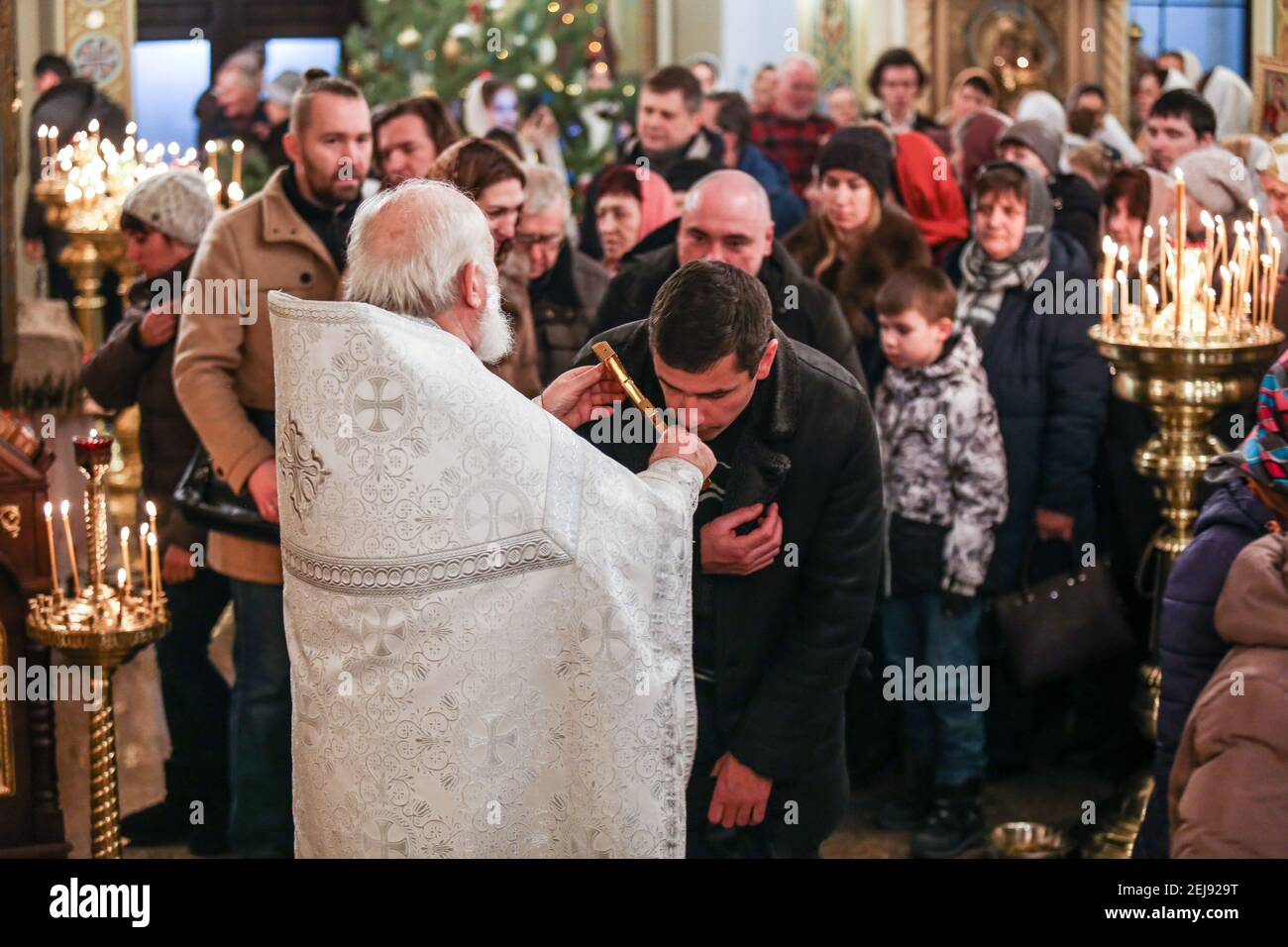 A priest and believers at the Church of Nativity of the Blessed Virgin