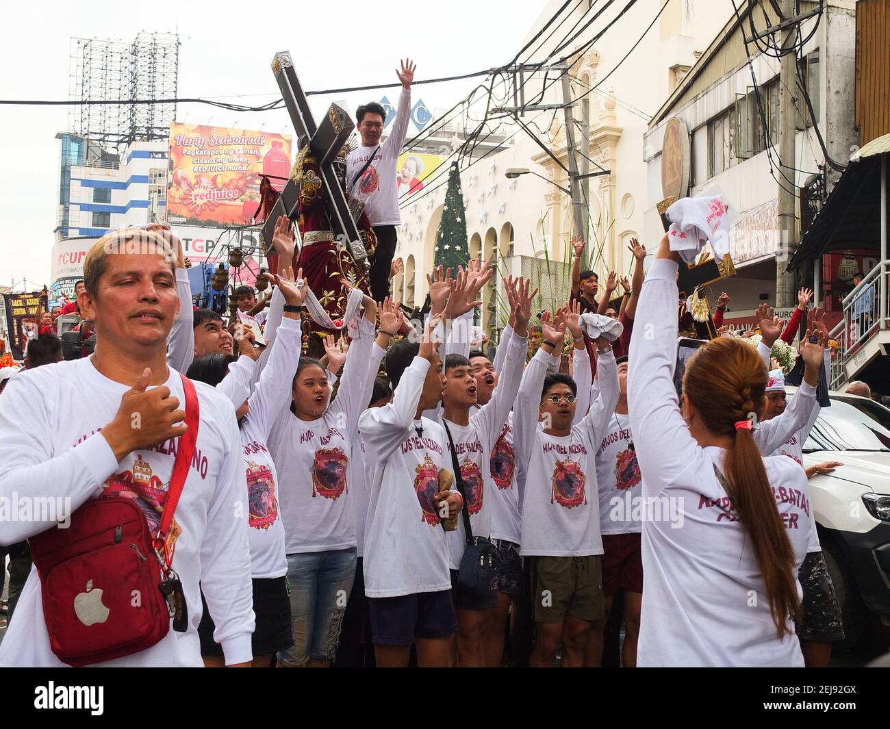 Members of Hijos del Nazareno or the Sons of the Black Nazarene sing ...