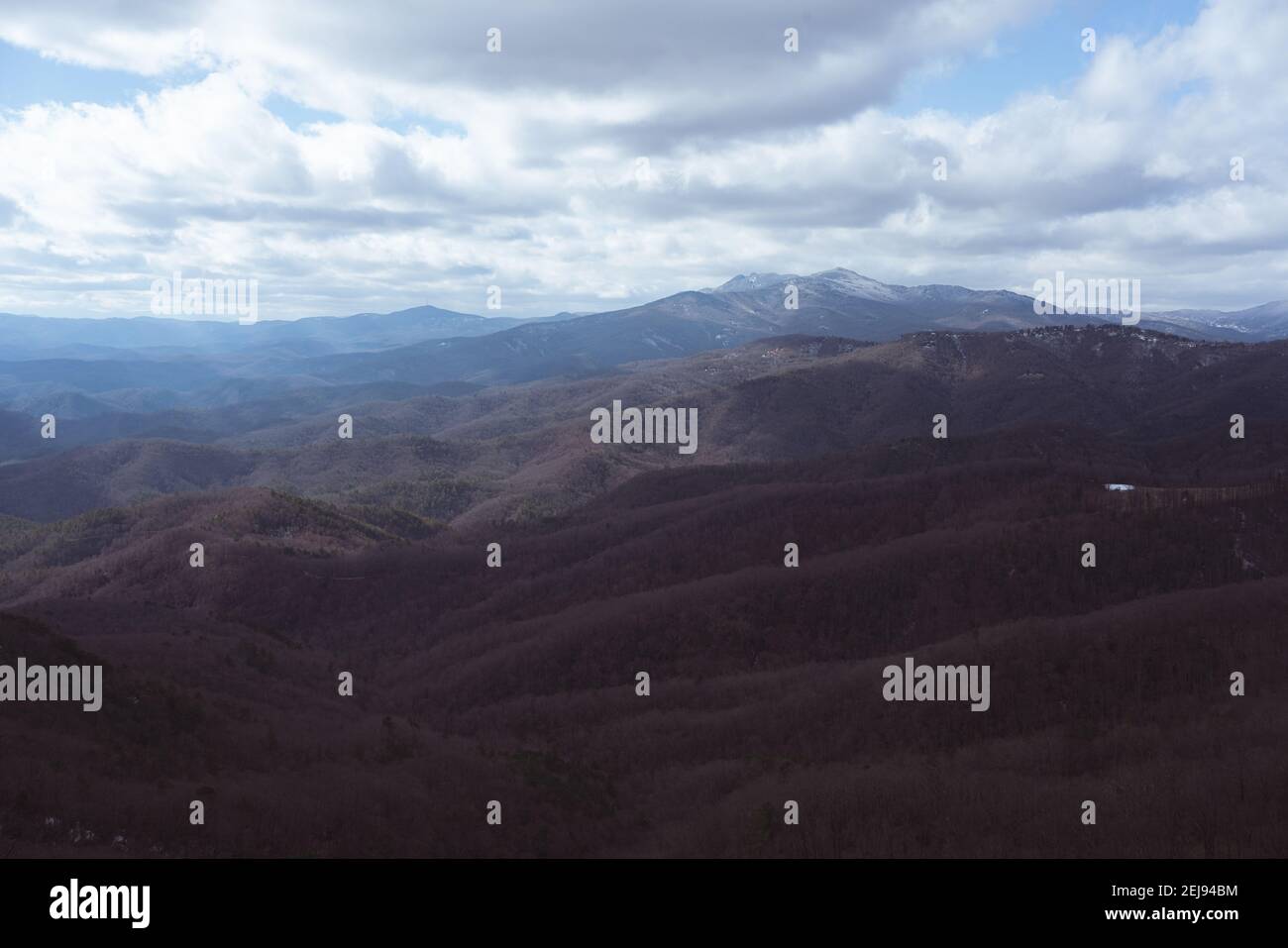 Mesmerizing view of mountain ranges under a cloudy sky Stock Photo - Alamy