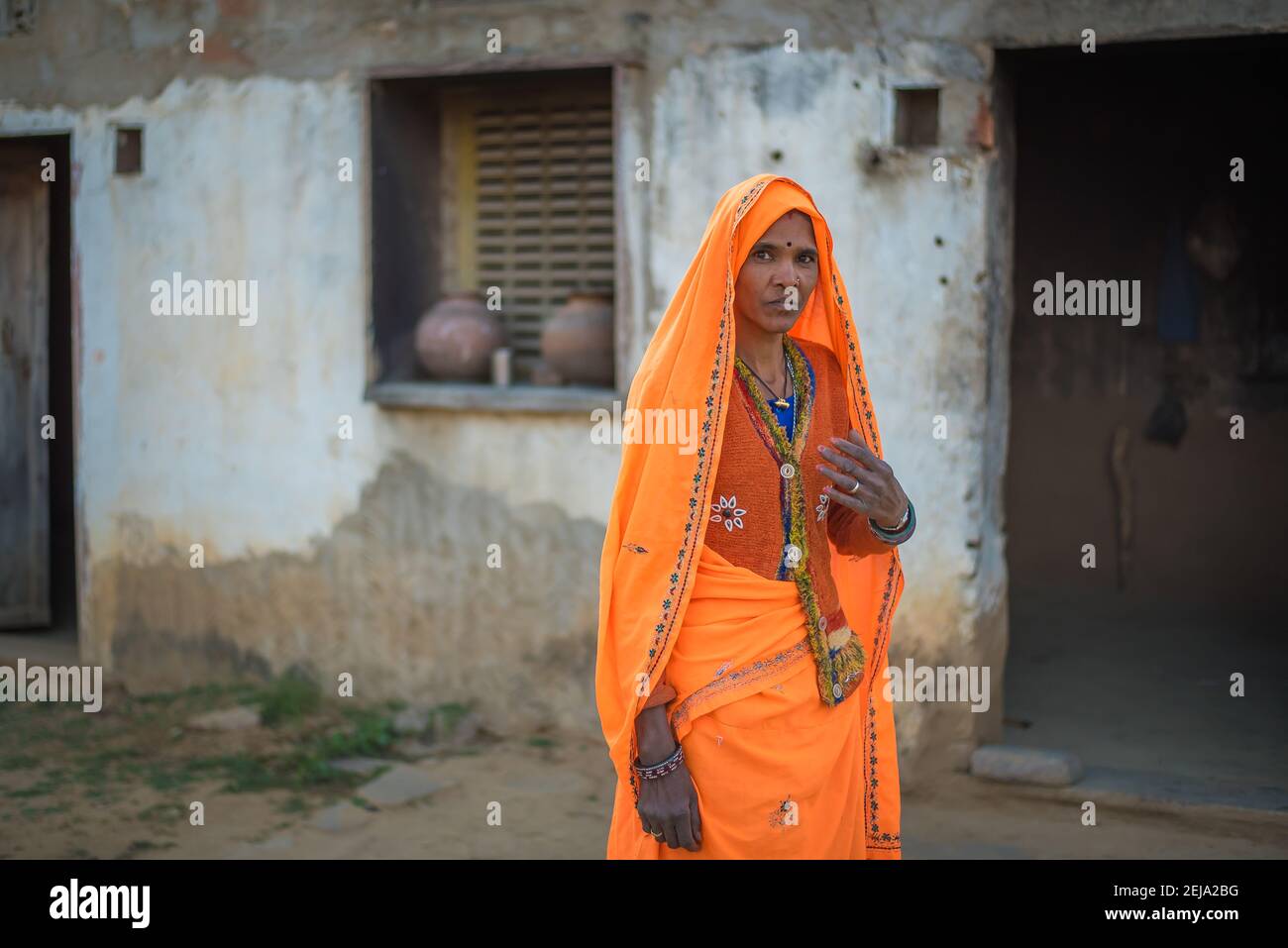 Rajasthan. India. 07-02-2018. Woman at her house in rural community. Women apart of taking care of children, they have an important role financial pro Stock Photo