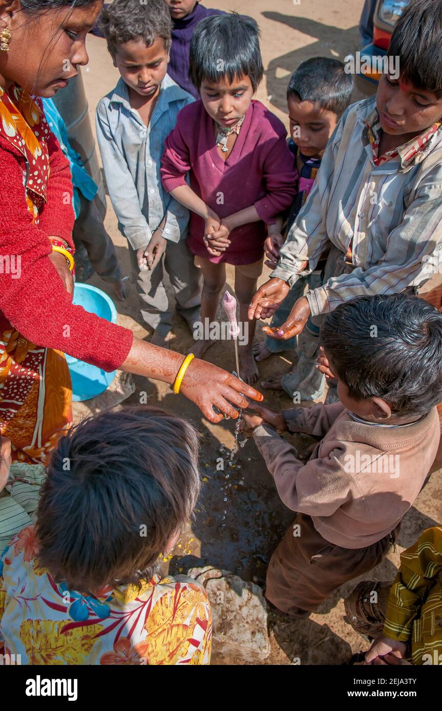 Rajasthan. India. 07-02-2018.Children drinking water at their rural community. Specially low caste people suffer from extreme poverty and luck of oppo Stock Photo