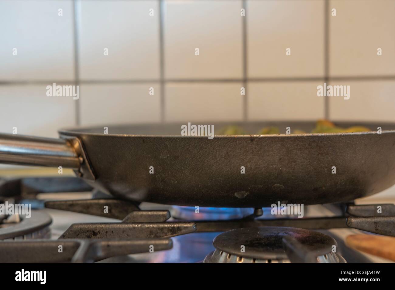 Pan cooking meal on a gas stovetop Stock Photo Alamy