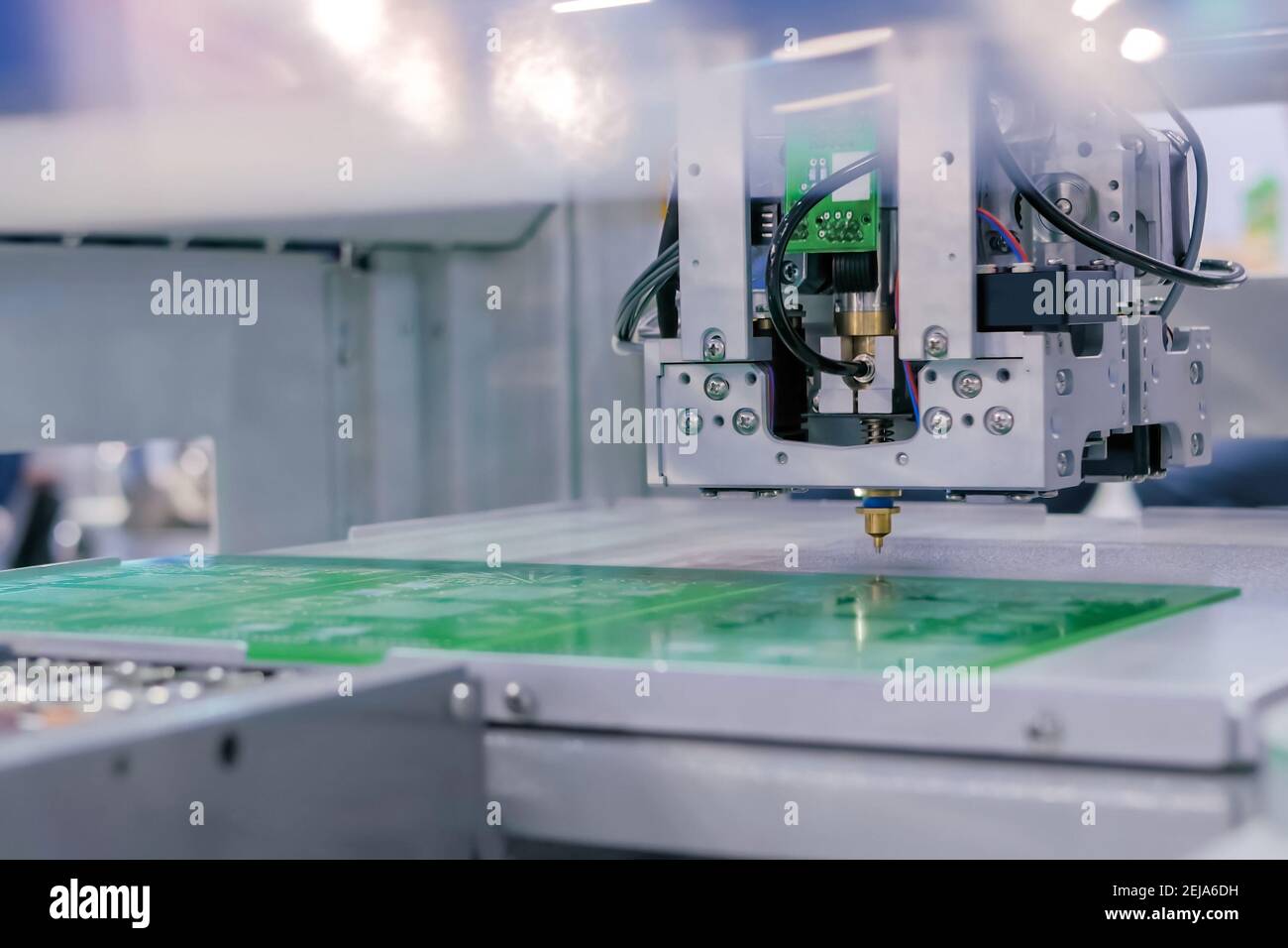 SMD pick and place machine assembling computer circuit board - front view Stock Photo