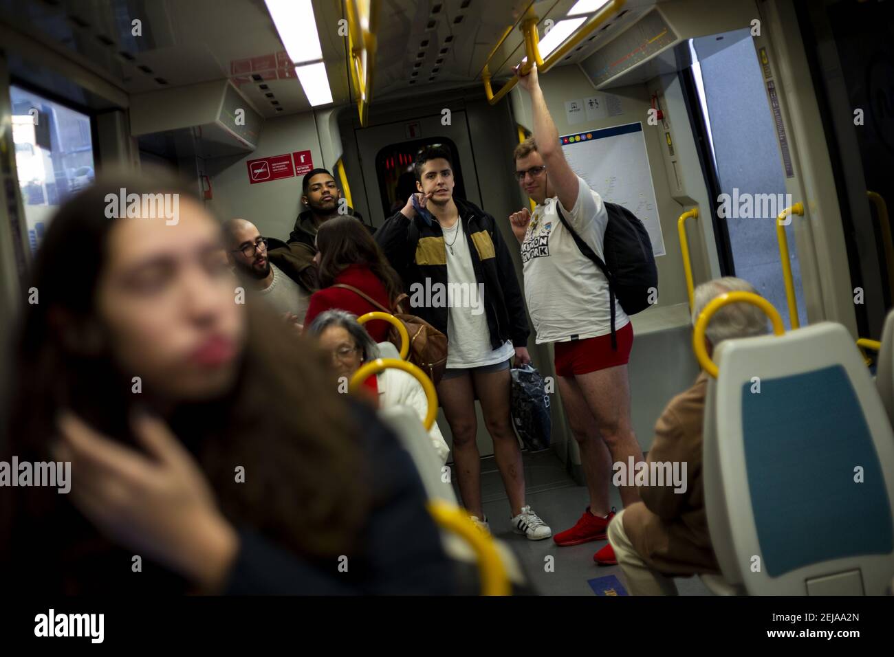 People with no pants ride in the subway. The annual No Pants Subway