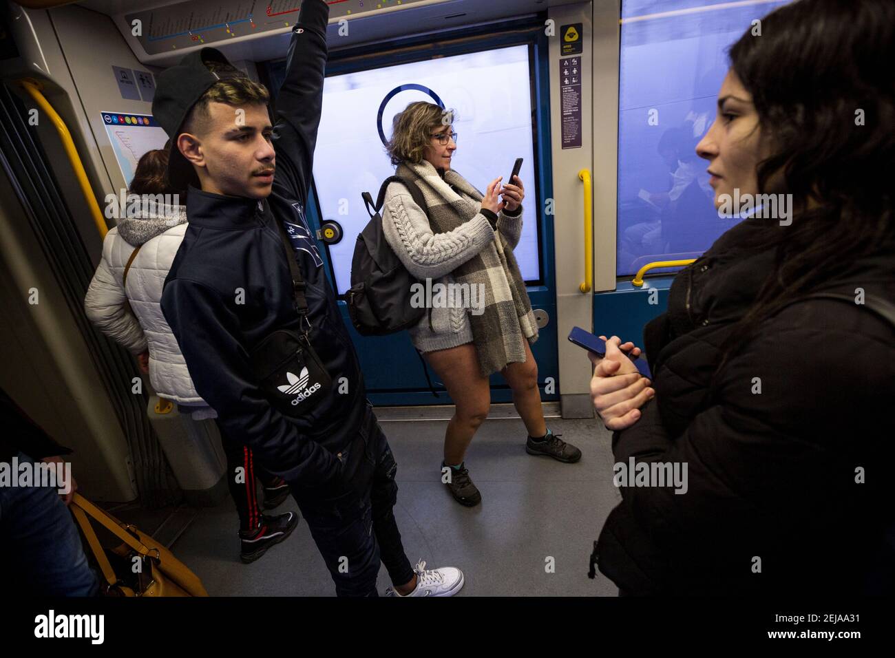 People with no pants ride in the subway. The annual No Pants Subway