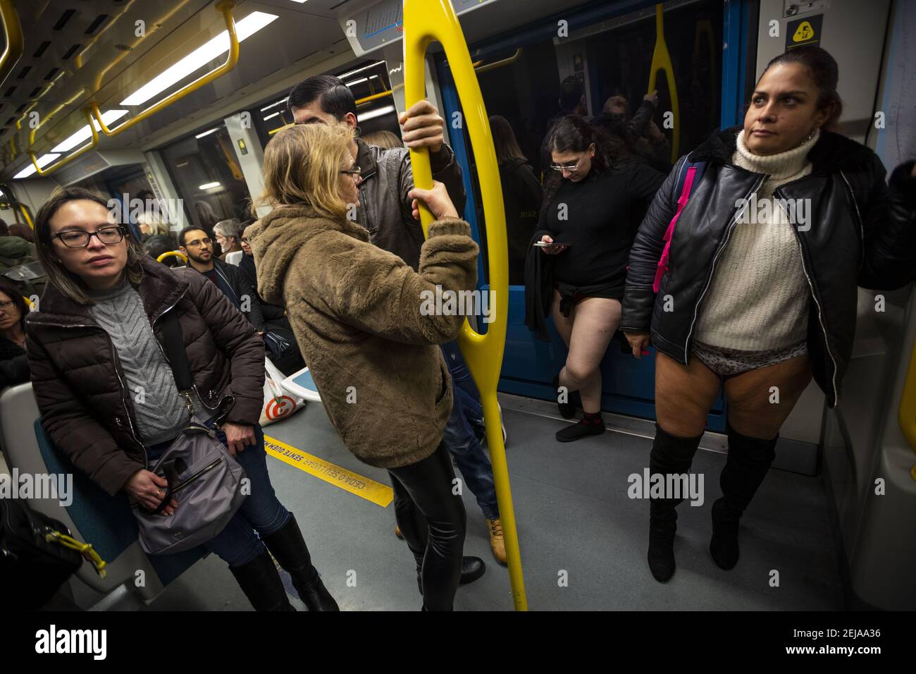 People with no pants ride in the subway. The annual No Pants Subway(00)