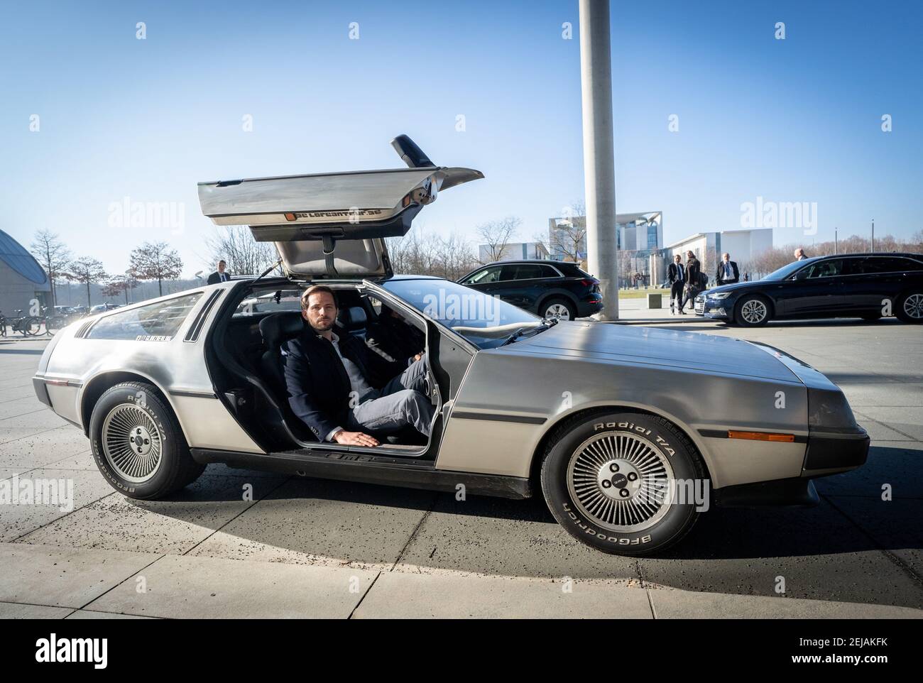 Berlin, Germany. 22nd Feb, 2021. Christoph Weigler, Germany head of Uber, gets out of the 'Back to the Future' DeLorean in front of the Paul Löbe House. Weigler attends the public hearing in the Bundestag's transport committee on the planned reform of passenger transport law. Credit: Kay Nietfeld/dpa/Alamy Live News Stock Photo