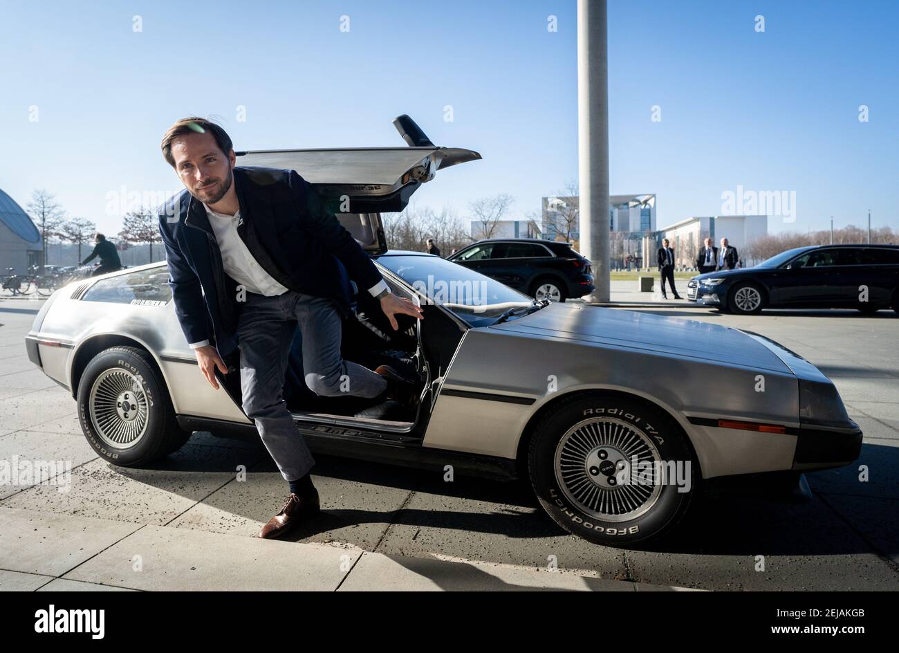 Berlin, Germany. 22nd Feb, 2021. Christoph Weigler, Germany head of Uber, gets out of the 'Back to the Future' DeLorean in front of the Paul Löbe House. Weigler attends the public hearing in the Bundestag's transport committee on the planned reform of passenger transport law. Credit: Kay Nietfeld/dpa/Alamy Live News Stock Photo