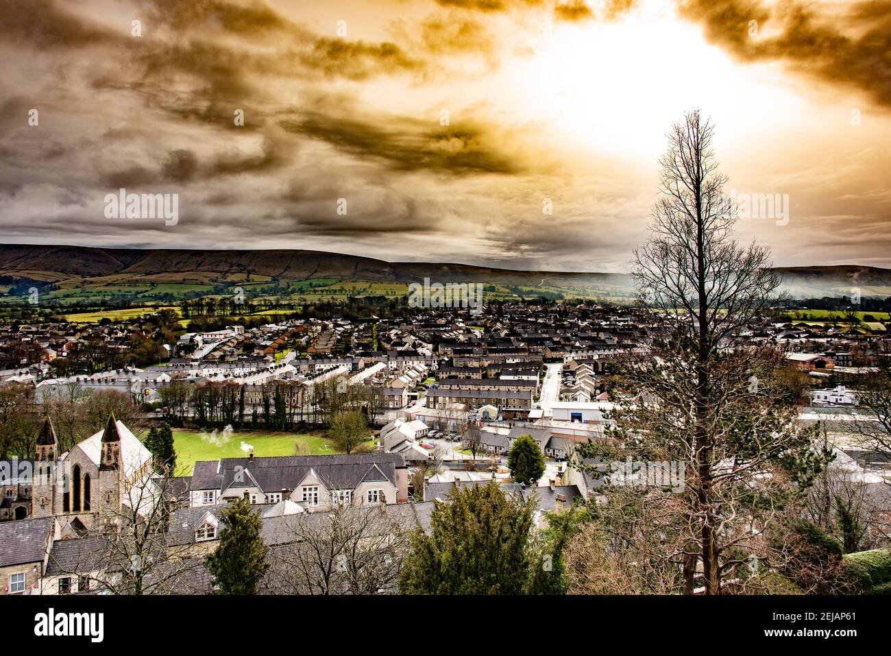 Clitheroe, Lancashire, UK.  22nd February 2021  The sun trying to break through the clouds at Clitheroe, Lancashire.  Credit John Eveson/Alamy Live News. Stock Photo