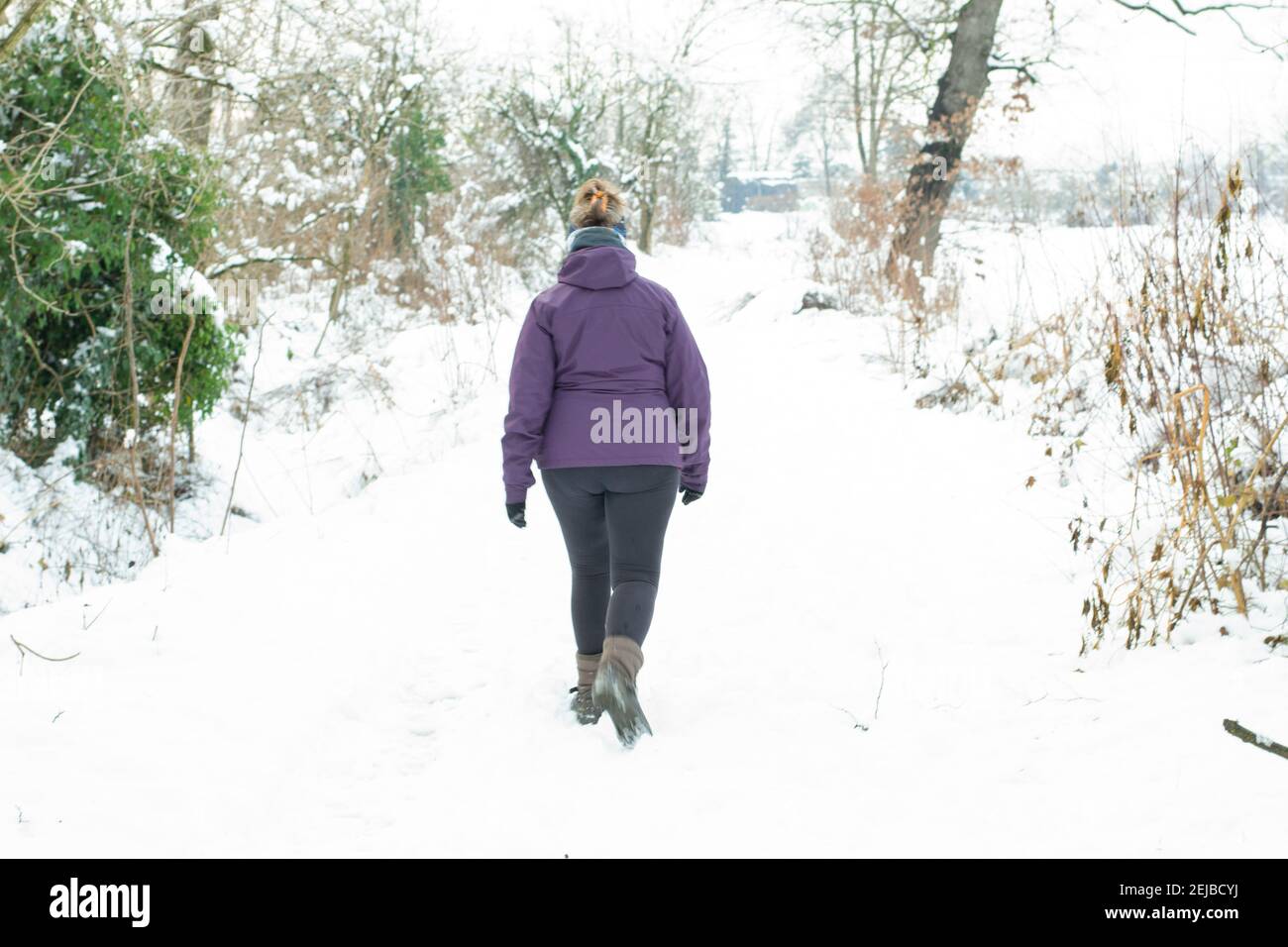 Girl in snow walking alone hi-res stock photography and images - Alamy
