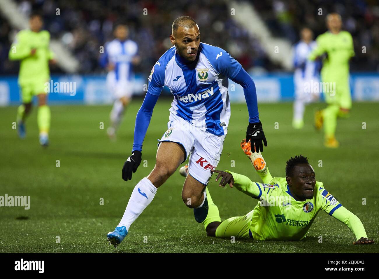 Martin Braithwaite of CD Leganes and Djene Dakoman of Getafe FC are seen in  action during the La Liga match between CD Leganes and Getafe CF at  Butarque Stadium in Leganes. (Final