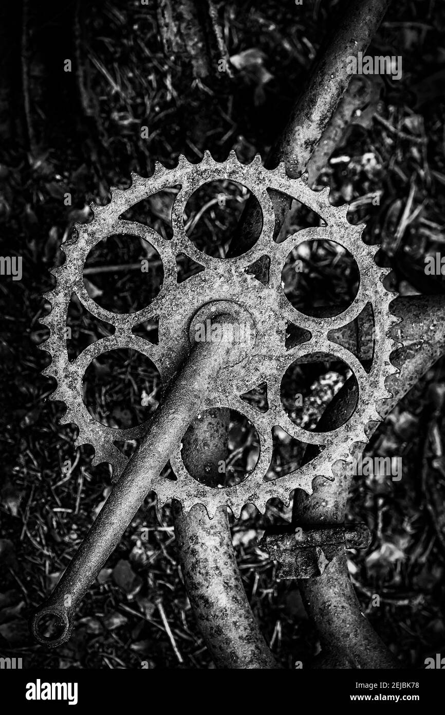 A close up of an abandoned bike at the car graveyard situated in a forest at Kirkoe Mosse, Sweden. Stock Photo