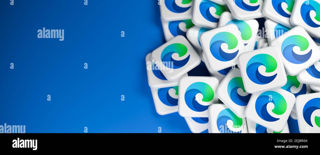 Logos of the Microsoft browser Edge app on a heap. Web banner size with copy space - Selective focus Stock Photo