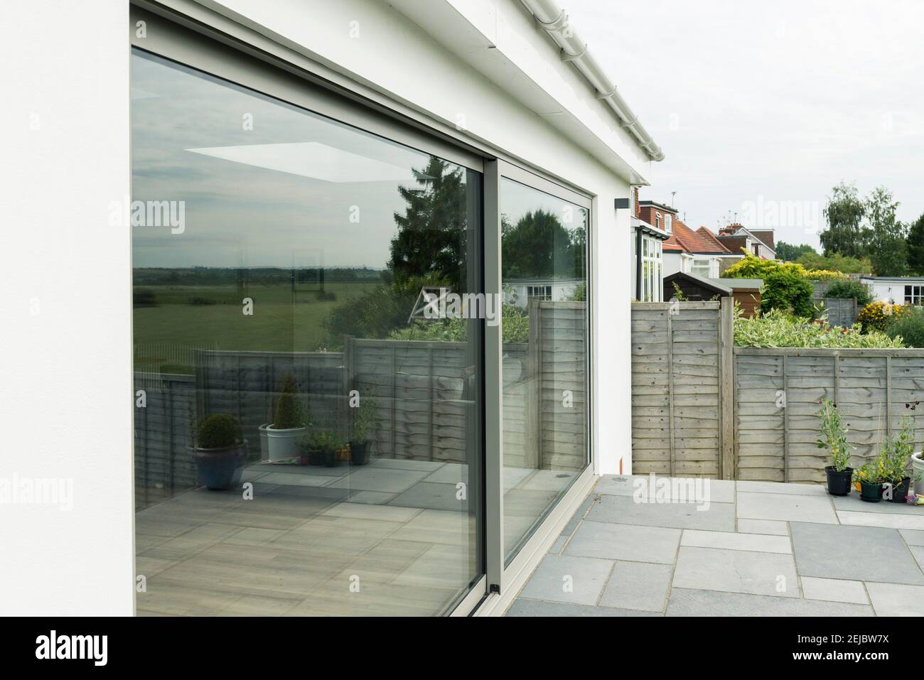 Very big sliding patio double glazed doors opening into a garden Stock Photo