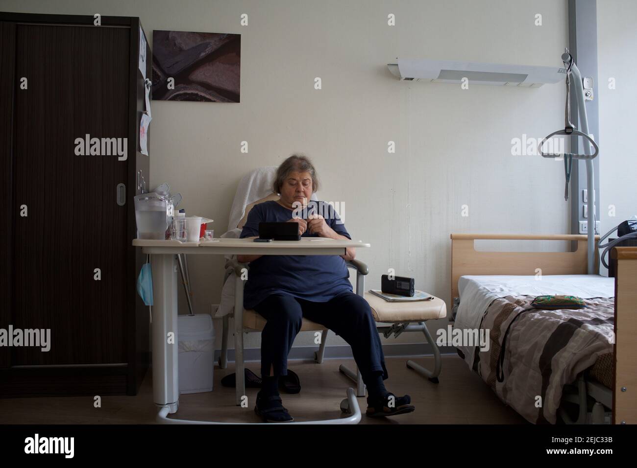 Patient in room, residential care home - Paris, France Stock Photo