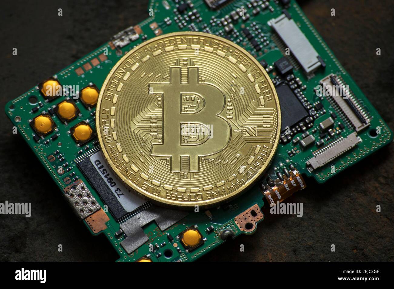 bitcoin logo coin on computer parts Stock Photo