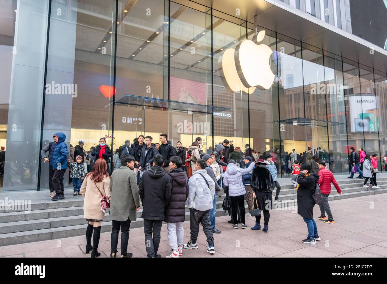 Customers Crowd The Apple Store On The Nanjing Road Shopping Street In