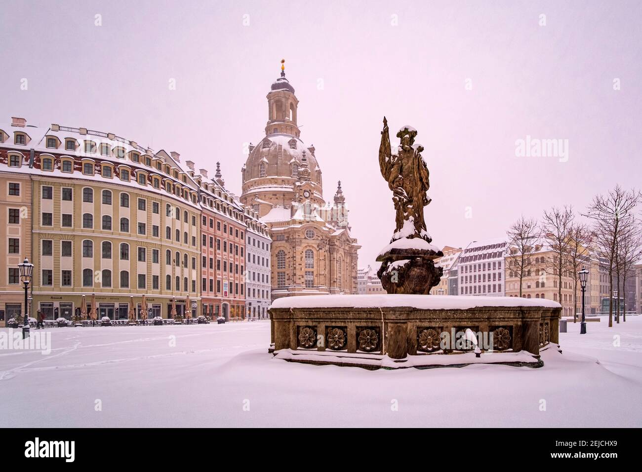 Panoramic view of the square Neumarkt, the fountain Friedensbrunnen and the Church of our Lady in winter, the square covered in snow. Stock Photo